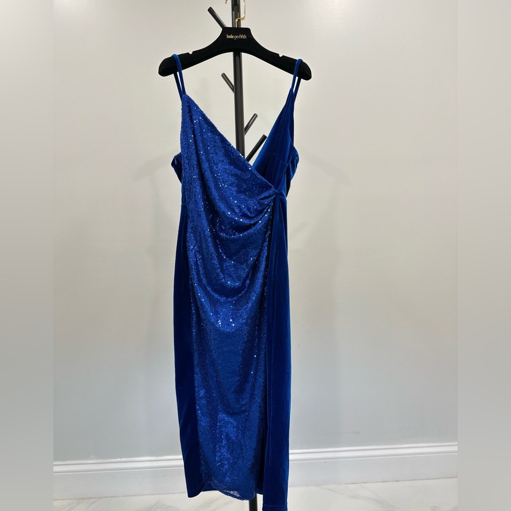 Deep blue velvet cocktail dress with sequins on the front.